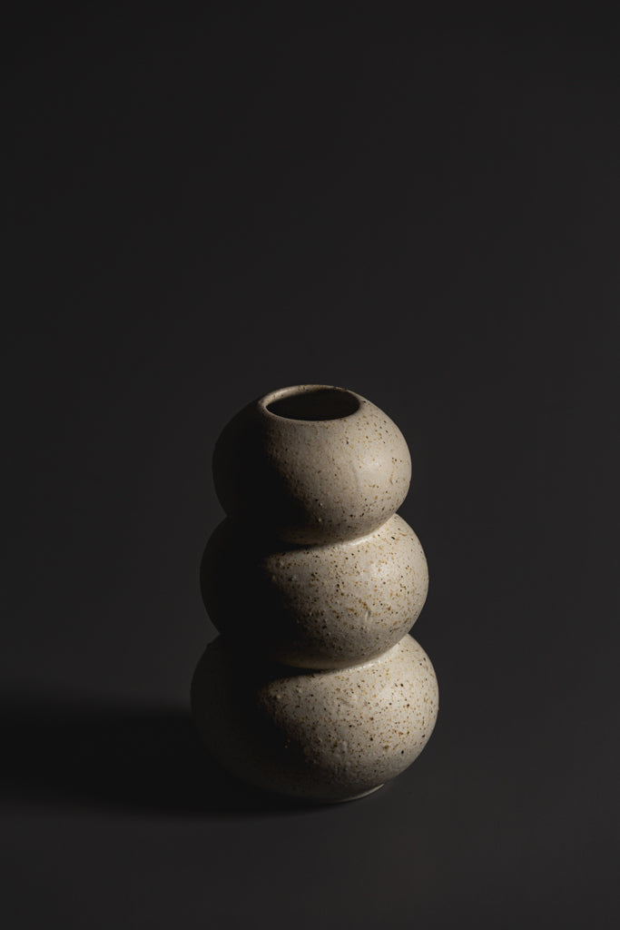 Handcrafted in natural tones and organic in nature this ceramic vase is a unique Australian homeware piece to adorn your home.  Type: Ceramic Vase  Materials: Stoneware  Dimensions: 180 x 110mm