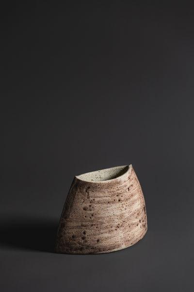 Handcrafted in natural tones and organic in nature this terrestrial vase is a unique Australian homeware piece to adorn your home.  Type: Ceramic Vase  Materials: Stoneware  Dimensions: 110 x 180mm