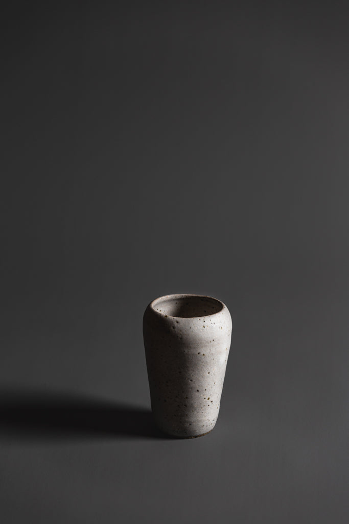 Rebecca’s objects possess a whimsy. With unabashed spontaneity in each handmade piece, nothing is left behind. This handcrafted vase is a natural, beautiful piece of Australian homeware. Type: Vase  Material: Stoneware  Dimensions: 110 x 75mm