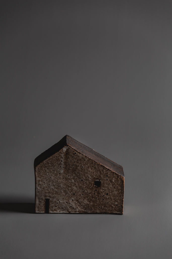 Handcrafted in Melbourne in natural tones and organic in nature this house sculpture is a fine Australian homeware piece to adorn your home or window sill. Each piece is unique. Type: House Sculpture   Material: Ceramic  Dimensions: 120 x 150 x 45mm 