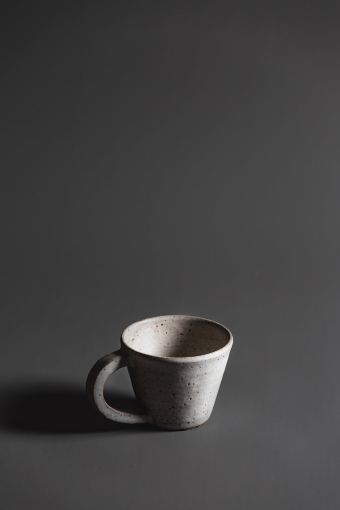 Handcrafted in Melbourne, Bec's connection with clay form has an Asobimasu playfulness. Using recycled clay and glazing, this organic mug embodies the acceptance of oddity and imperfection. Type: Mug  Material: Stoneware  Dimensions: 130 x 70mm     370mls