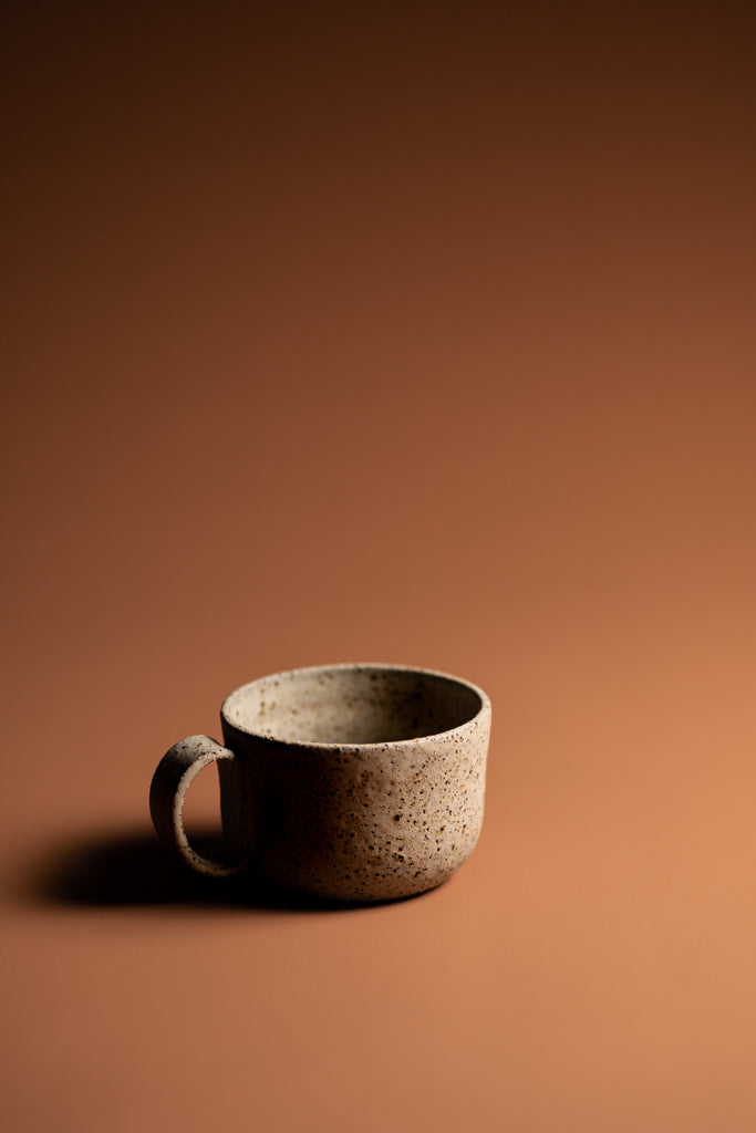 Handmade organic mug. A natural, handcrafted homeware piece made Kristin in Melbourne. Balancing artistic expression with functionality.   Type: Mug  Material: Stoneware  Dimensions: 140 x 65mm     250mls
