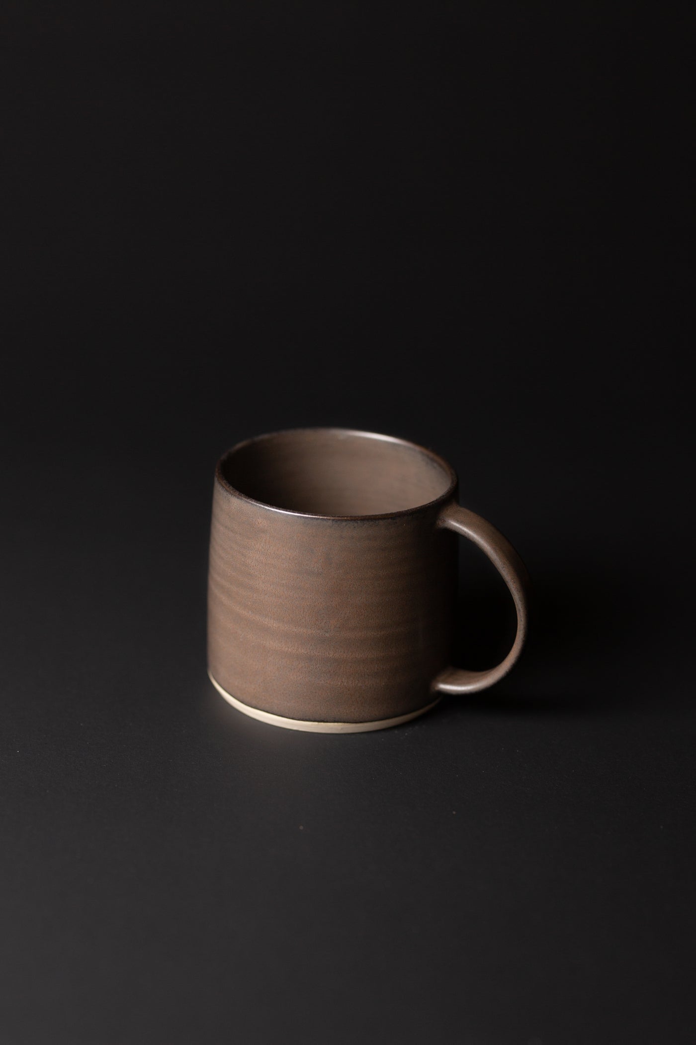 Handcrafted in natural tones and organic in nature this smooth mug is a fine Australian homeware piece. Type: Mug   Material: Stoneware  Dimensions: 80 x 135mm (450ml)