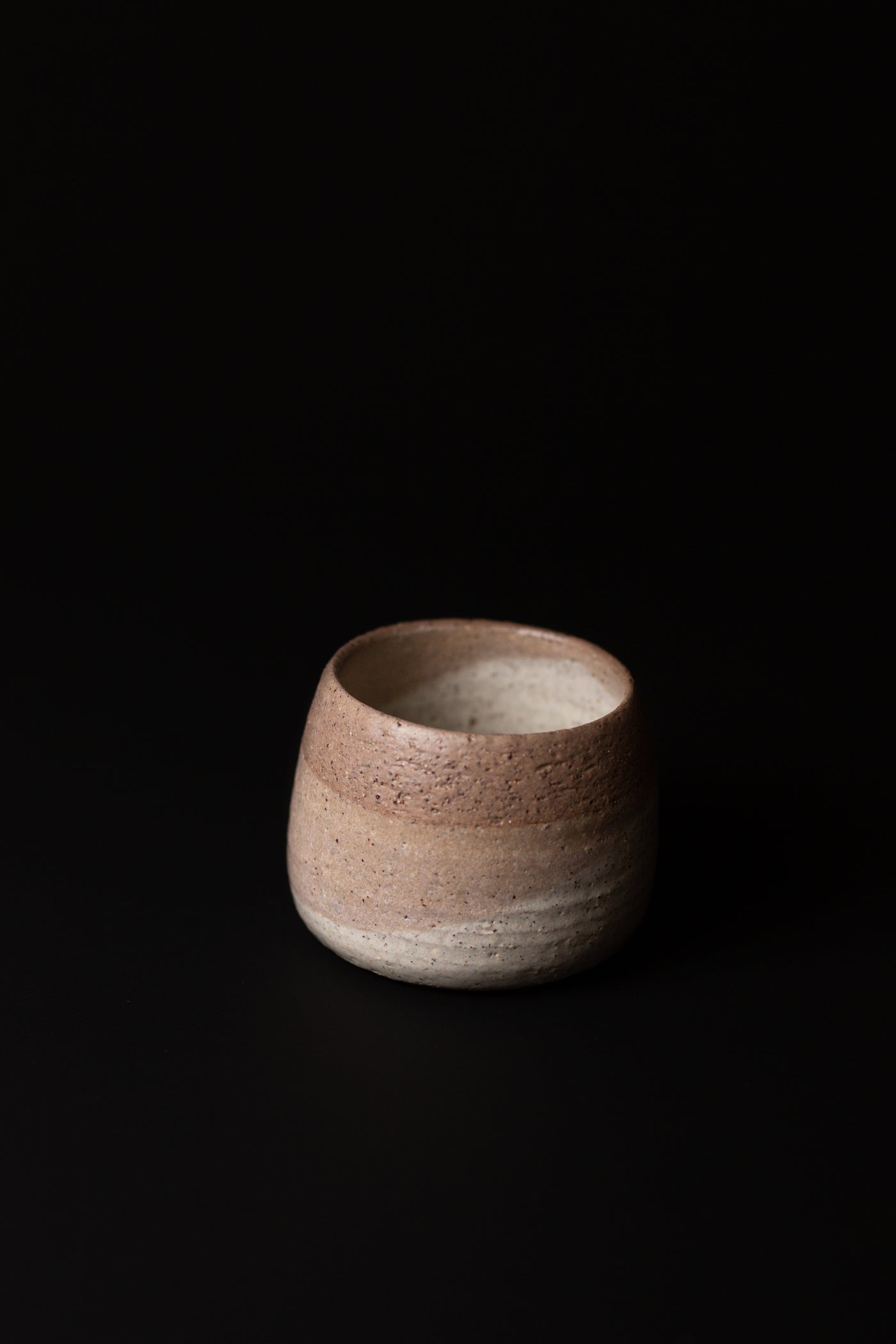 Handmade organic cup in earthy tones. A natural, handcrafted homeware piece made in Melbourne. Katrina is deeply inspired by sustainability. Type: Tumbler, Cup  Material: Stoneware  Dimensions: 100 x 80mm   300mls