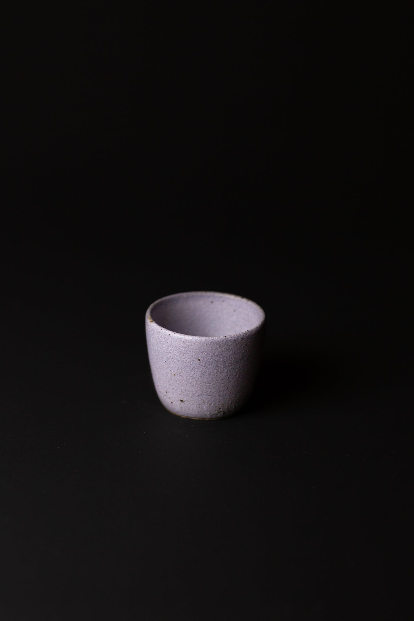 Handcrafted in Melbourne, Bec's connection with clay form has an Asobimasu playfulness. Using recycled clay and glazing, this organic cup embodies the acceptance of oddity and imperfection.  Type: Tea Cup  Material: Stoneware  Dimensions: 70 x 60mm     120mls